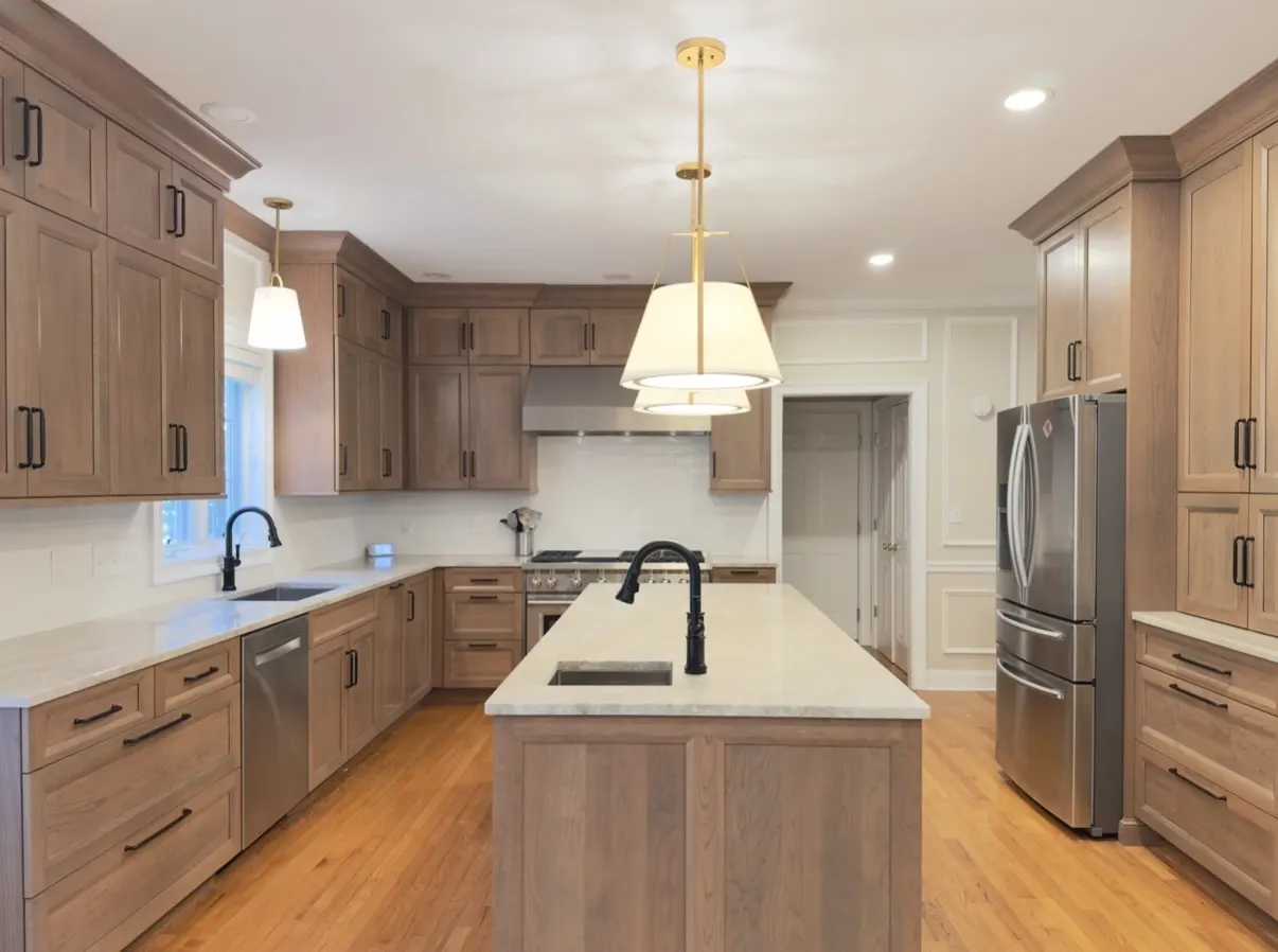 Custom kitchen with warm wood cabinetry and island built by Custom Renovations by Dave